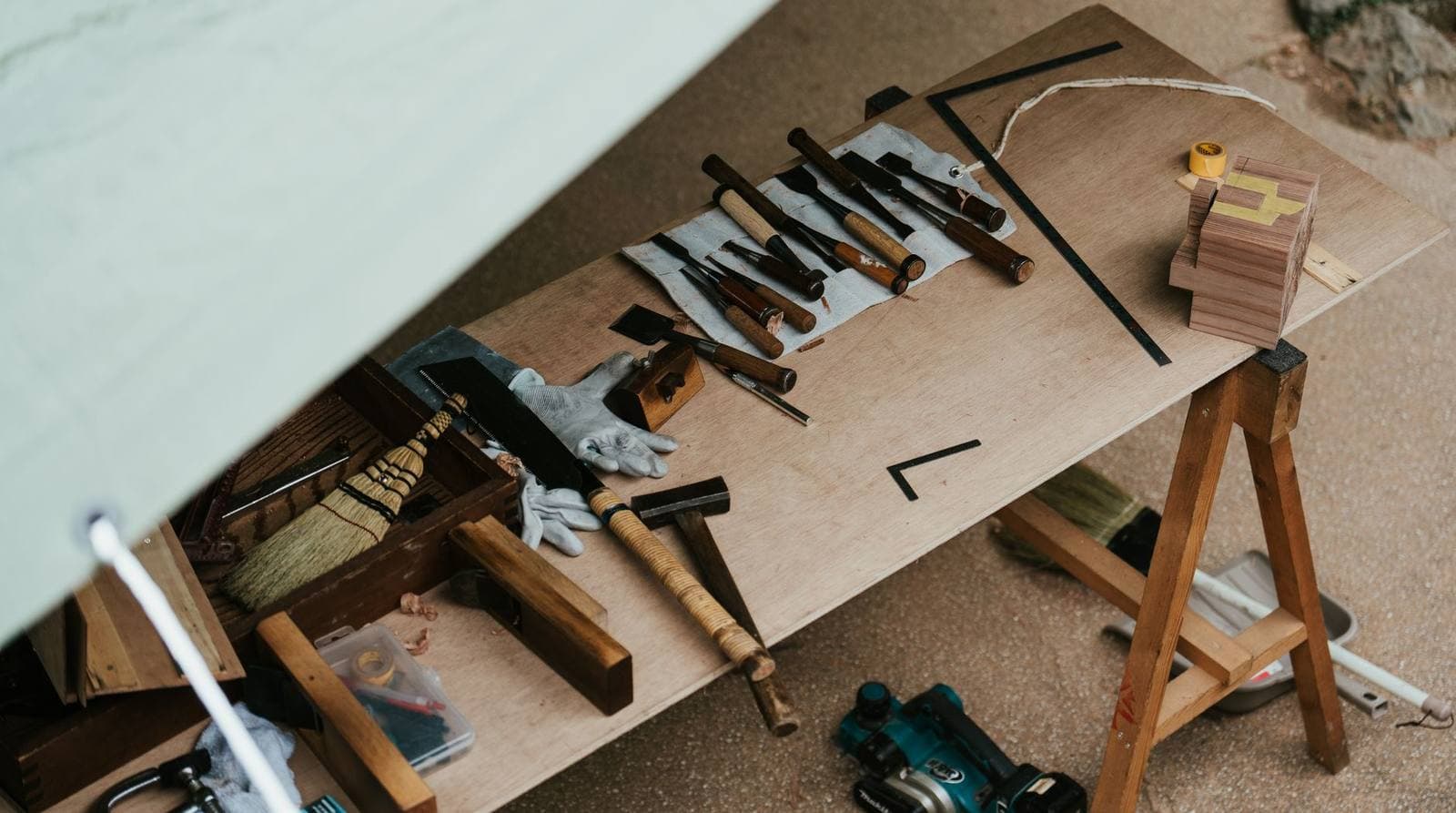 Woodworking hand tools arranged on a workbench